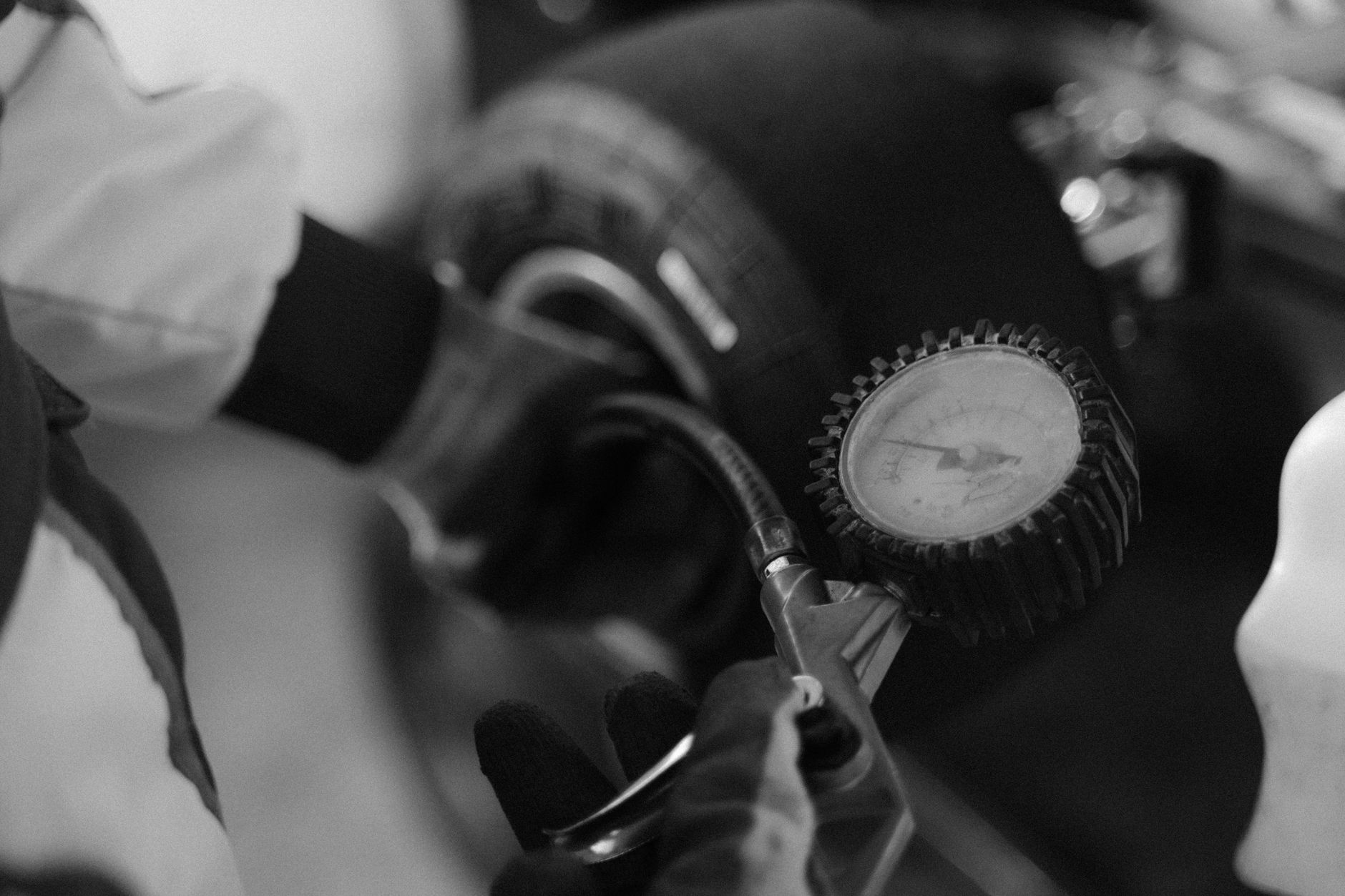 Checking tire pressure with a gauge