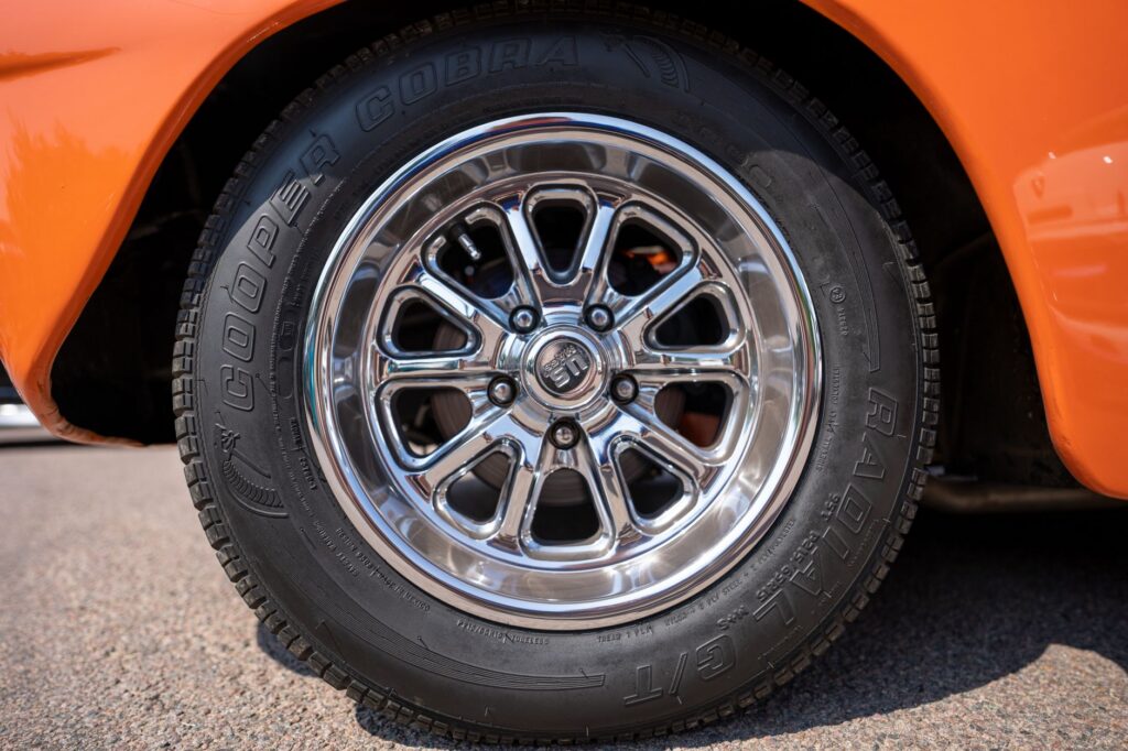 Close-up of a car tire sidewall showing the size markings