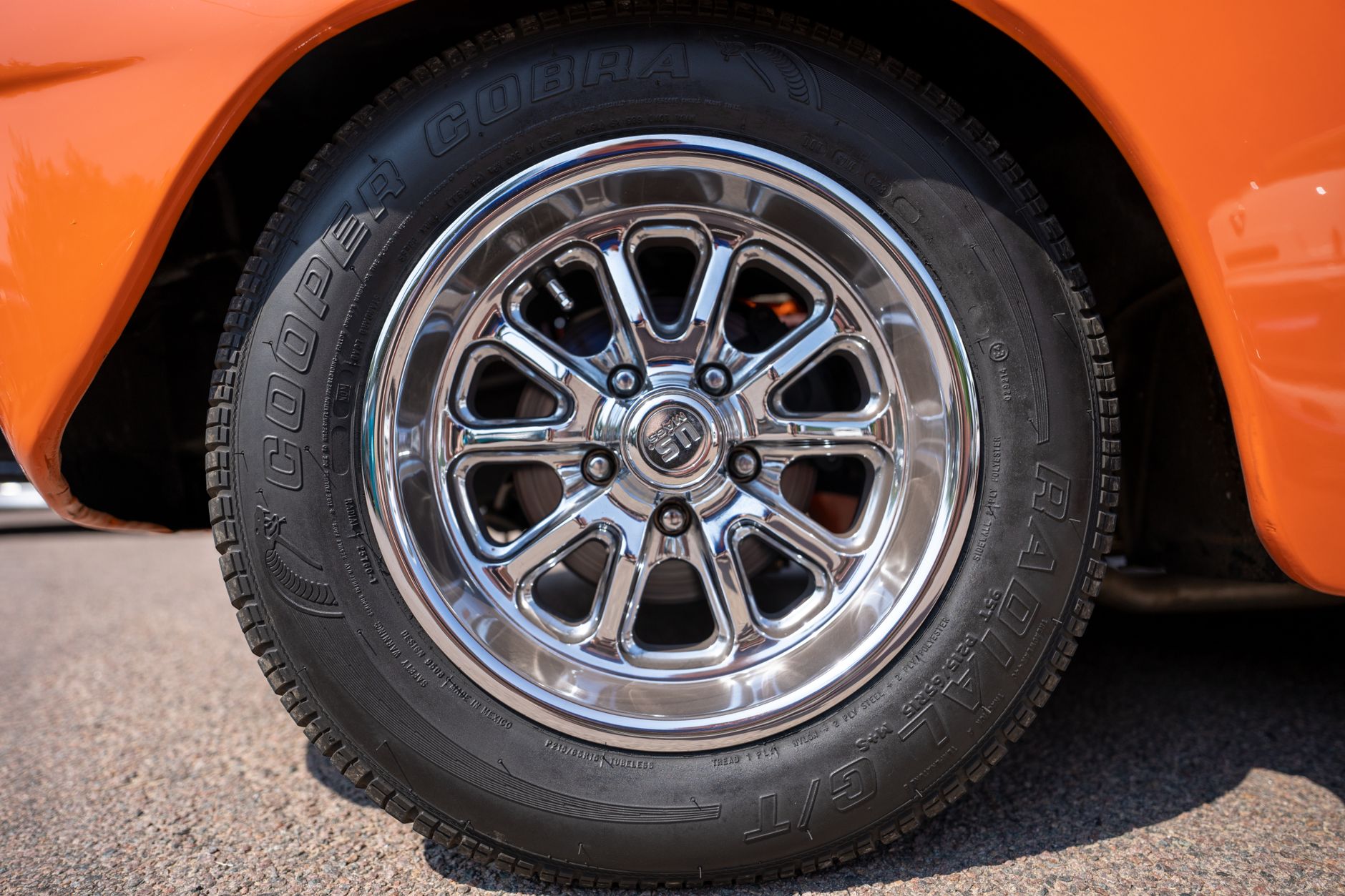 Close-up of a car tire sidewall showing the size markings